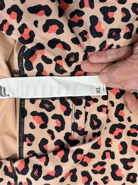 Fabletics Leopard Print Active Leggings in Peach and Black with Coral Accents